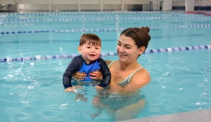 Fremont indoor swim school children smiling in heated pool